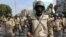 Egyptian army special forces soldiers stand guard near the Republican Guard headquarters, in Cairo. Thousands of protesters are holding rallies across Egypt to demand the reinstatement of ousted President Mohammed Morsi.