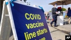 FILE - A sign is shown at a COVID-19 vaccine site in the Bayview neighborhood of San Francisco, Feb. 8, 2021. U.S. health officials worry Black Americans are lagging behind whites in getting vaccinated.