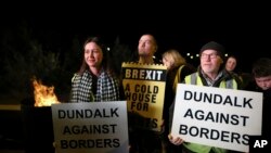 Protesters from the Border Communities Against Brexit group hold a demonstration on the Irish border on the Republic of Ireland side close to the town of Jonesborough, Ireland, Oct. 16 , 2019. 