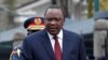 FILE - Kenya's President Uhuru Kenyatta arrives to inspect an honor guard before the annual State of the Nation address at the Parliament Buildings in Nairobi, Kenya, May 2, 2018.