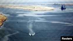 A general view of the Suez Canal is seen from Al Salam "Peace" bridge on the Ismalia desert road before the opening ceremony of the New Suez Canal, in Egypt, Aug. 6, 2015. 