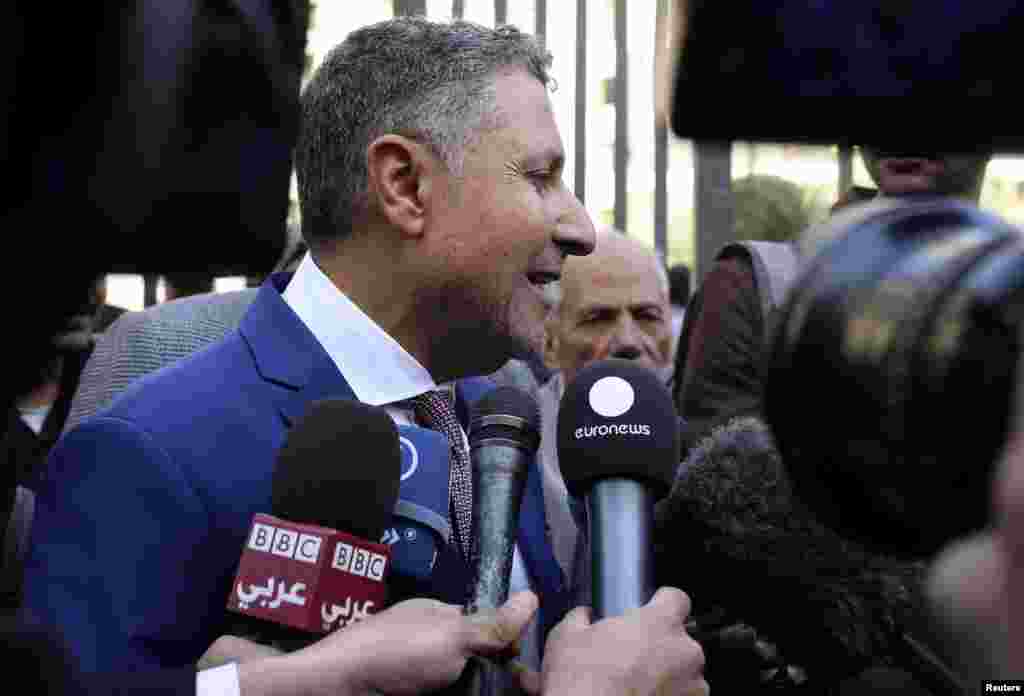 Negad al-Borai, lawyer of Canadian-Egyptian Mohamed Fahmy, one of the journalists encarcerated in Egypt while working for Al Jazeera television, speaks to the media in front of a court in Cairo, Jan. 1, 2015. 