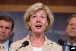 FILE - Sen. Tammy Baldwin, D-Wis., pictured at a Washington news conference in July 2015, will address the 2016 Democratic National Convention in Philadelphia. Baldwin is the first openly gay person to serve in the U.S. Senate.