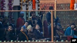 Japanese Prime Minister Shinzo Abe, center, watches Indian fighter planes flying past as the chief guest at the Indian Republic Day parade in New Delhi, India, Jan. 26, 2014. 