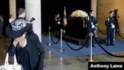 A woman cries after viewing the casket of Nancy Reagan at the Ronald Reagan Presidential Library, March 10, 2016, in Simi Valley, California.