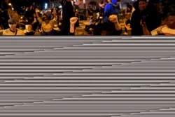 Demonstrators react as a helicopter circles low as people gather to protest the death of George Floyd, June 1, 2020, near the White House in Washington. Floyd died after being restrained by Minneapolis police officers.