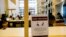 A sign about social distancing is placed on a table at the National Library in Singapore, March 16, 2020.