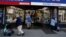 Shoppers are seen outside a retail store as the phase one reopening of New York City continues during the outbreak of the coronavirus disease (COVID-19) in the Brooklyn borough of New York City, New York, U.S. June 9, 2020.