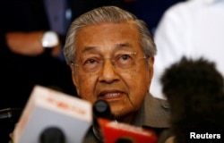 FILE - Mahathir Mohamad speaks during a news conference following the general election in Petaling Jaya, Malaysia, May 10, 2018.