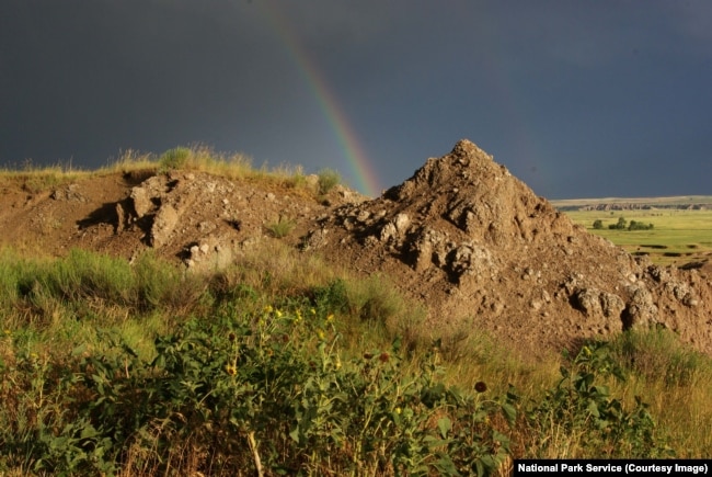 A rainbow forms after a storm at Badlands National Park