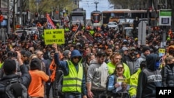Construction workers and demonstrators attend a protest against Covid-19 regulations in Melbourne, Australia, Sept. 21, 2021. 