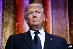 President-elect Donald Trump speaks during the presidential inaugural Chairman's Global Dinner, Jan. 17, 2017, in Washington.