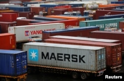 Trucks carrying containers wait to enter the Jawaharlal Nehru Port Trust (JNPT) on the outskirts of Mumbai, India, June 28, 2017.