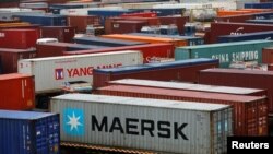 Trucks carrying containers wait to enter the Jawaharlal Nehru Port Trust (JNPT) on the outskirts of Mumbai, India, June 28, 2017. 