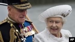 FILE - Britain's Queen Elizabeth and Prince Philip leave from Chelsea Harbour in London on a launch on the first part of their journey in the Diamond Jubilee River Pageant, June 3, 2012 .