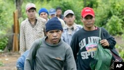 Montagnards emerge from the forest after having fled from neighbouring Vietnam in Korng village, Ratanakiri province, northeastern Cambodia, 10 kilometers (6.3 miles) from the Vietnamese border, file photo. 