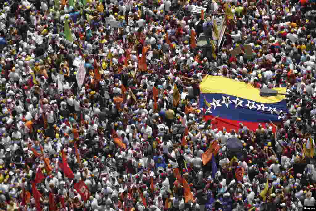Opposition supporters march to protest against Nicolas Maduro's government in Caracas, Venezuela.