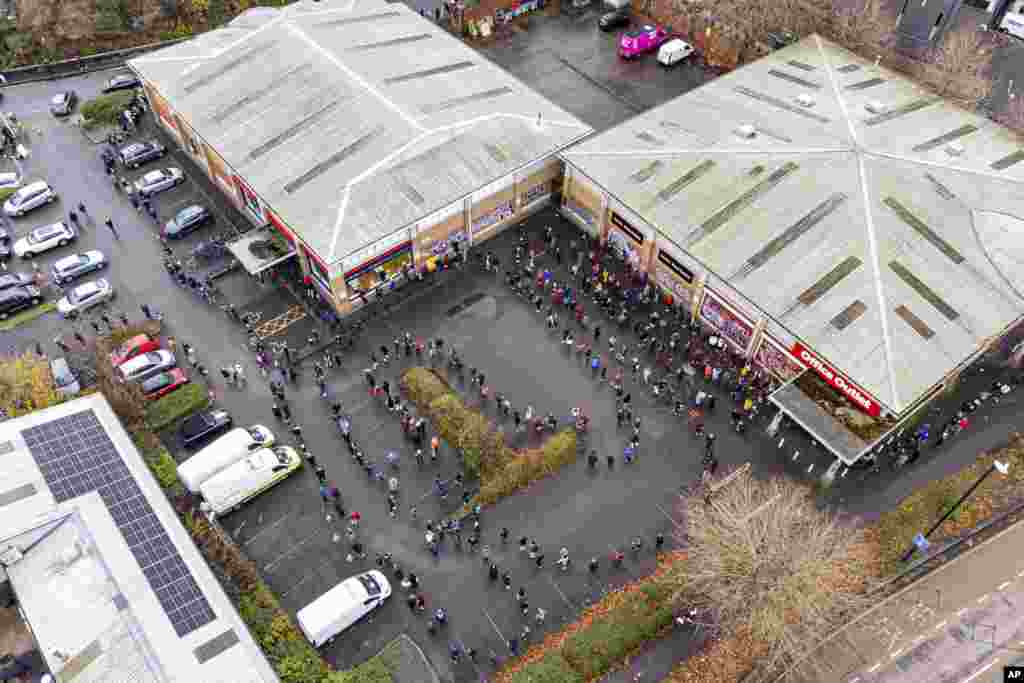 Hundreds of people line up at a vaccination center in Bristol, England.