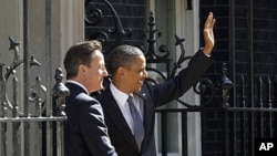 US President Barack Obama, right, with British Prime Minister David Cameron in front of 10 Downing Street in London, Wednesday, May 25, 2011