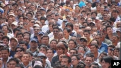 FILE - Faces in the crowd at the peace assembly in Kathmandu, May 7, 2010.