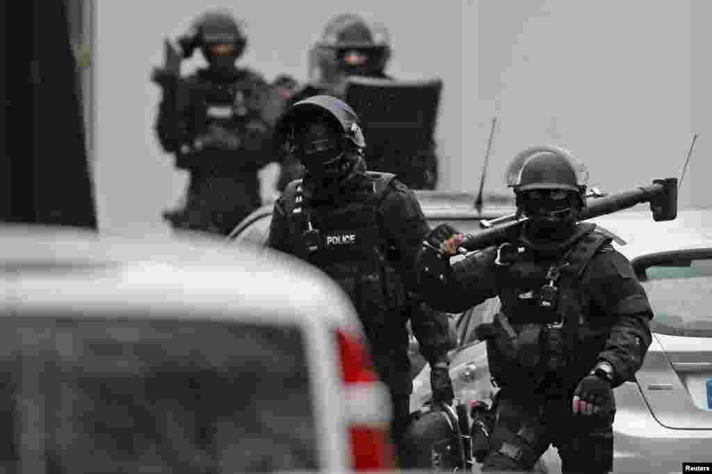 French special police forces Research and Intervention Brigade (BRI) at the scene of a shooting in Montrouge, near Paris, Jan. 8, 2015.