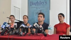 Dancers from the famed National Ballet of Cuba, who defected during a weekend performance in Puerto Rico, hold a news conference in Miami, Florida, June 10, 2014.