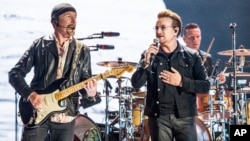 The Edge (left) and Bono of U2 perform at the Bonnaroo Music and Arts Festival, June 9, 2017, in Manchester, Tenn.