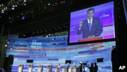 US Republican presidential candidate Mitt Romney is seen on the screen during the presidential candidate debate in Ames, Iowa, August 12, 2011 (file photo)