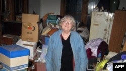 Sally Fronsman-Cecil in her house in Topeka, Kansas. She went into the "downward spiral" life of a hoarder after her husband died in 1998.