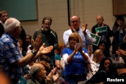 Voters react to a question from the audience to U.S. Representative Leonard Lance, R-N.J., during a town hall meeting with constituents in Cranford, New Jersey, May 30, 2017.