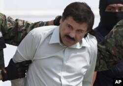 Joaquin "El Chapo" Guzman, the head of Mexico's Sinaloa Cartel, is being escorted to a helicopter in Mexico City following his capture overnight in the beach resort town of Mazatlan, Feb. 22, 2014.