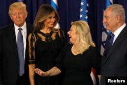 Melania Trump (2nd L) and Sara Netanyahu (2nd R) walk onstage with their respective husbands, U.S. President Donald Trump (L) and Israel's Prime Minister Benjamin Netanyahu (R), before a dinner at Netanyahu's residence in Jerusalem, May 22, 2017.