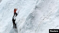 FILE - Climbers at Everest Base Camp practice their techniques on the Khumbu glacier before trying to summit Mount Everest, some 140km northeast of the Nepali capital Kathmandu, April 24, 2018.