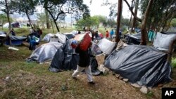 Venezuelan migrants camp in a park near the main bus terminal in Bogota, Colombia, Sept. 7, 2018.