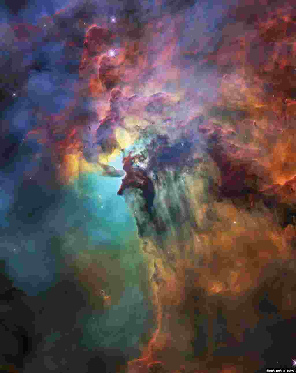 Выглядит экзотично, не правда ли? Из-за своих ярких цветов это межзвездное облако было названо Туманностью Лагуна. На этом снимке мы видим лишь небольшую ее часть.