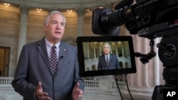 FILE - Sen. Luther Strange, R-Ala., responds to questions during a TV news interview on Capitol Hill in Washington, July 11, 2017. 