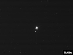 This image of Earth and the moon was taken by NASA's Cassini spacecraft on July 19, 2013. Image Credit: NASA/JPL-Caltech/Space Science Institute