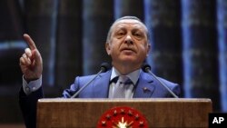 Turkish President Recep Tayyip Erdogan speaks during a meeting in Ankara, Turkey, Oct. 12, 2016.