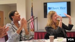 College of Charleston students Cora Webb, left, and ‘candidate’ Chelsea Roland celebrate their election victory in a mock campaign calling for self-defense classes in Charleston, South Carolina. (C. Guensburg/VOA) 