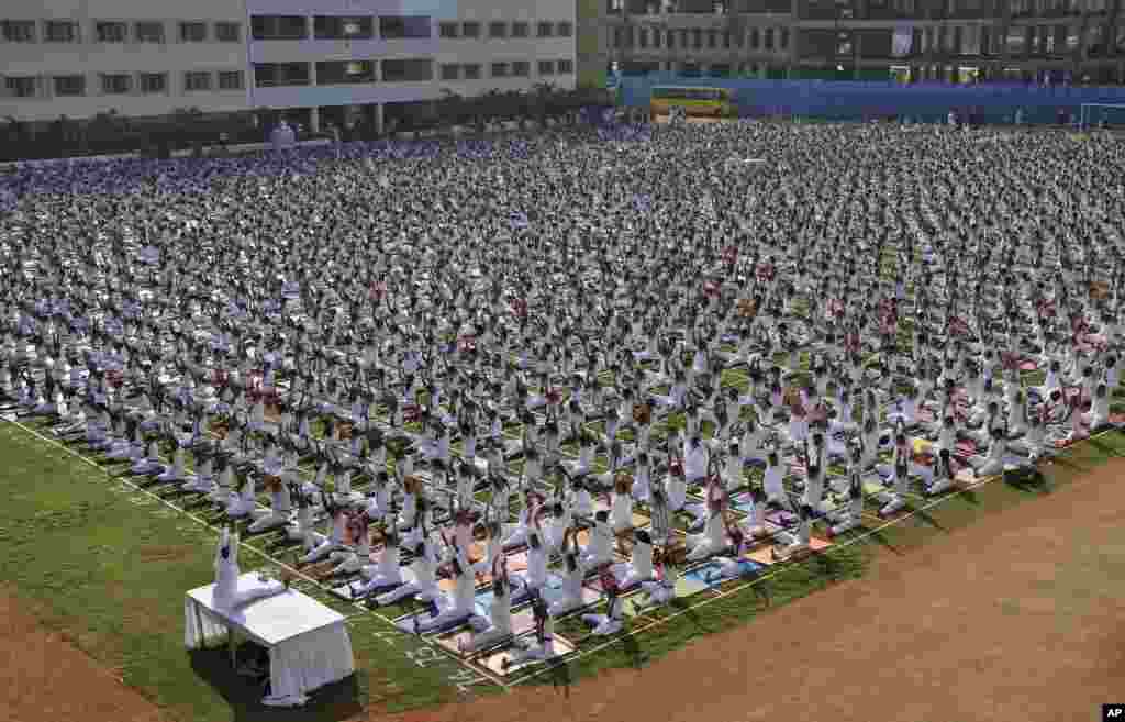 Indian schoolchildren perform yoga at a Delhi Public School in Hyderabad.