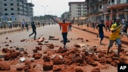 Supporters of a Guinea opposition party clash with police as they protest against President Alpha Conde on May 10, 2012 in Conakry. 