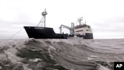 FILE - A research vessel searches for great white sharks on the Atlantic Ocean, Sept. 7, 2012. A global conference aimed at better protecting marine life concluded Friday, after raising more than $7 billion.