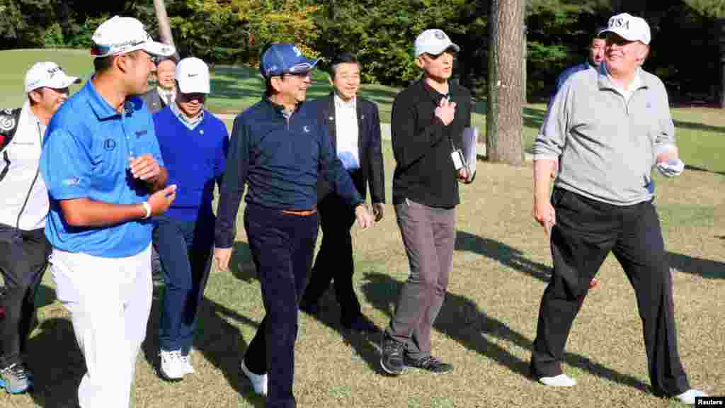 President Trump plays golf with Japan&#39;s Prime Minister Shinzo Abe.