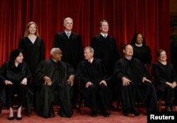 FILE PHOTO: U.S. Supreme Court justices pose for their group portrait at the Supreme Court in Washington