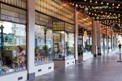 FILE - A mostly-empty city street is seen on the first day of a seven-day lockdown as the state of Victoria looks to curb the spread of a coronavirus disease (COVID-19) outbreak in Melbourne, Australia, May 28, 2021.