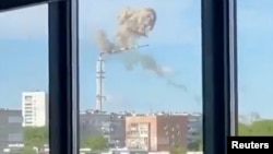 Smoke rises as a TV tower collapses after what local officials said was a missile attack, amid Russia's attack on Ukraine, in Kharkiv, Ukraine April 22, 2024, as seen in this screen grab taken from a video.