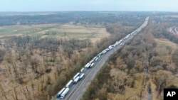 Trucks are stuck in traffic jams on the A12 autobahn in the direction of Poland near near Frankfurt (Oder), Germany, Tuesday, March 17, 2020.