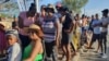 Namibians queue to cast their votes in a presidential election in Windhoek, Namibia, Nov. 27, 2024. 