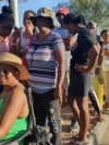 Namibians queue to cast their votes in a presidential election in Windhoek, Namibia, Nov. 27, 2024. 