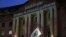 FILE - Light is projected by the League of Conservation Voters as part of the new Boot Pruitt campaign onto the Ronald Reagan Building and International Trade Center, the location of the Environmental Protection Agency, March 28, 2018, in Washington. 